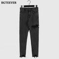 กางเกงยีนส์ทรงดินสอผู้หญิงขาดรูไม่สม่ำเสมอ ทรงเอวสูงสุดเก๋ ยืดหยุ่น