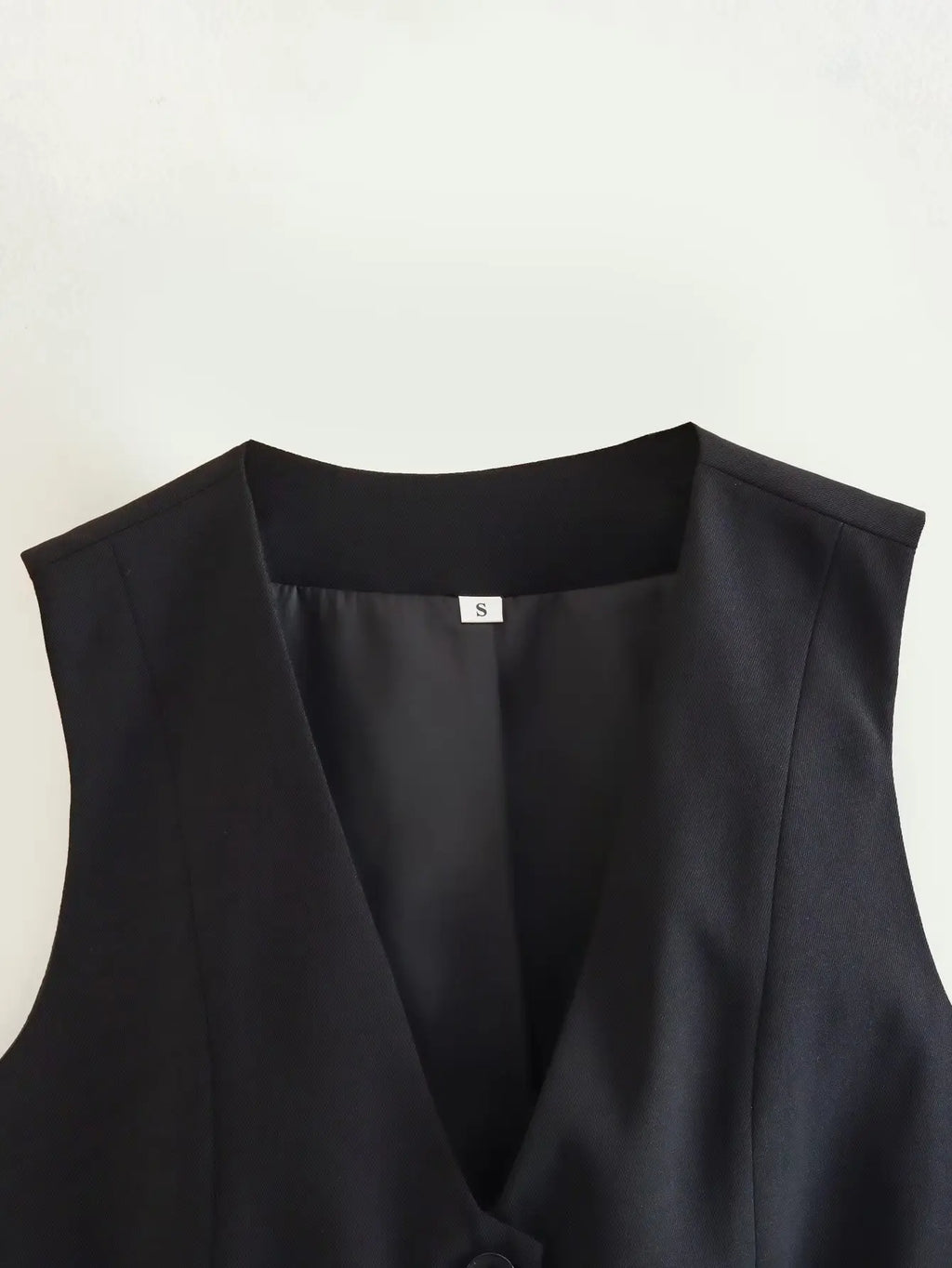 เสื้อกั๊กคลุมสตรีคอวีแขนกุดสไตล์วินเทจสีขาวสุดเก๋