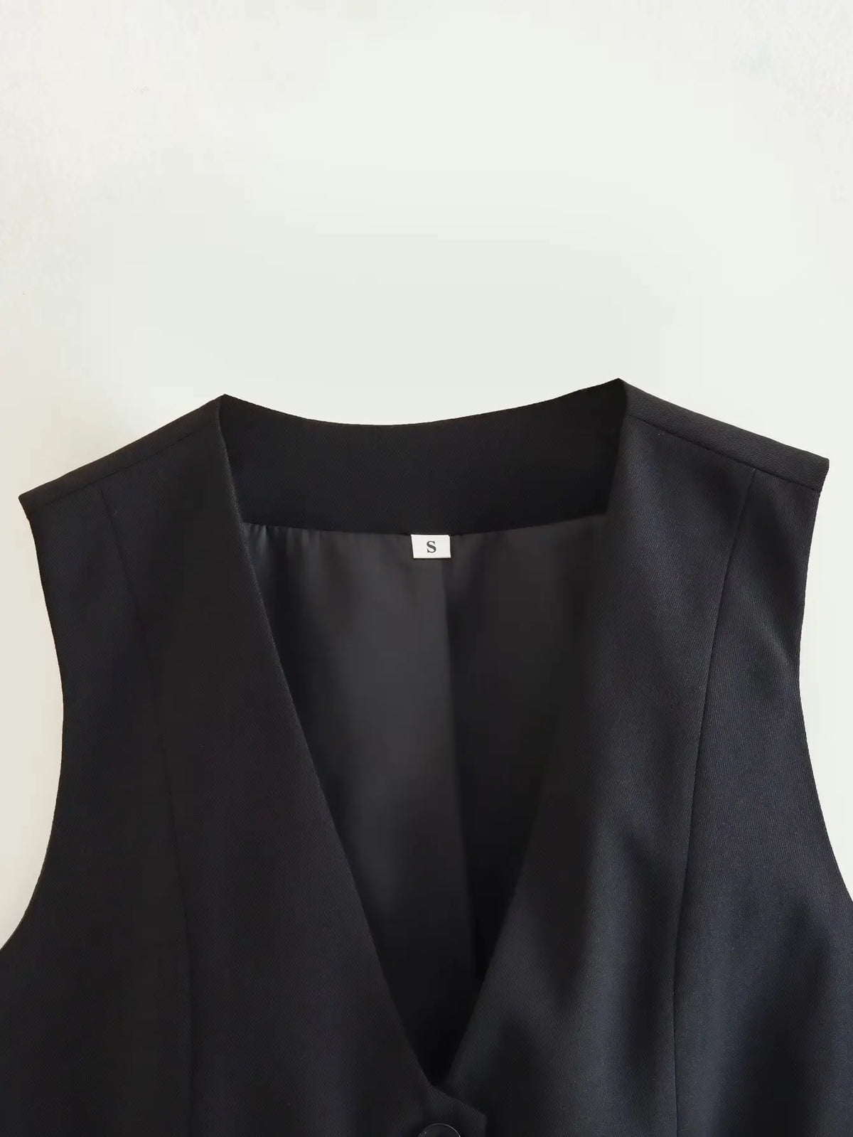 เสื้อกั๊กคลุมสตรีคอวีแขนกุดสไตล์วินเทจสีขาวสุดเก๋