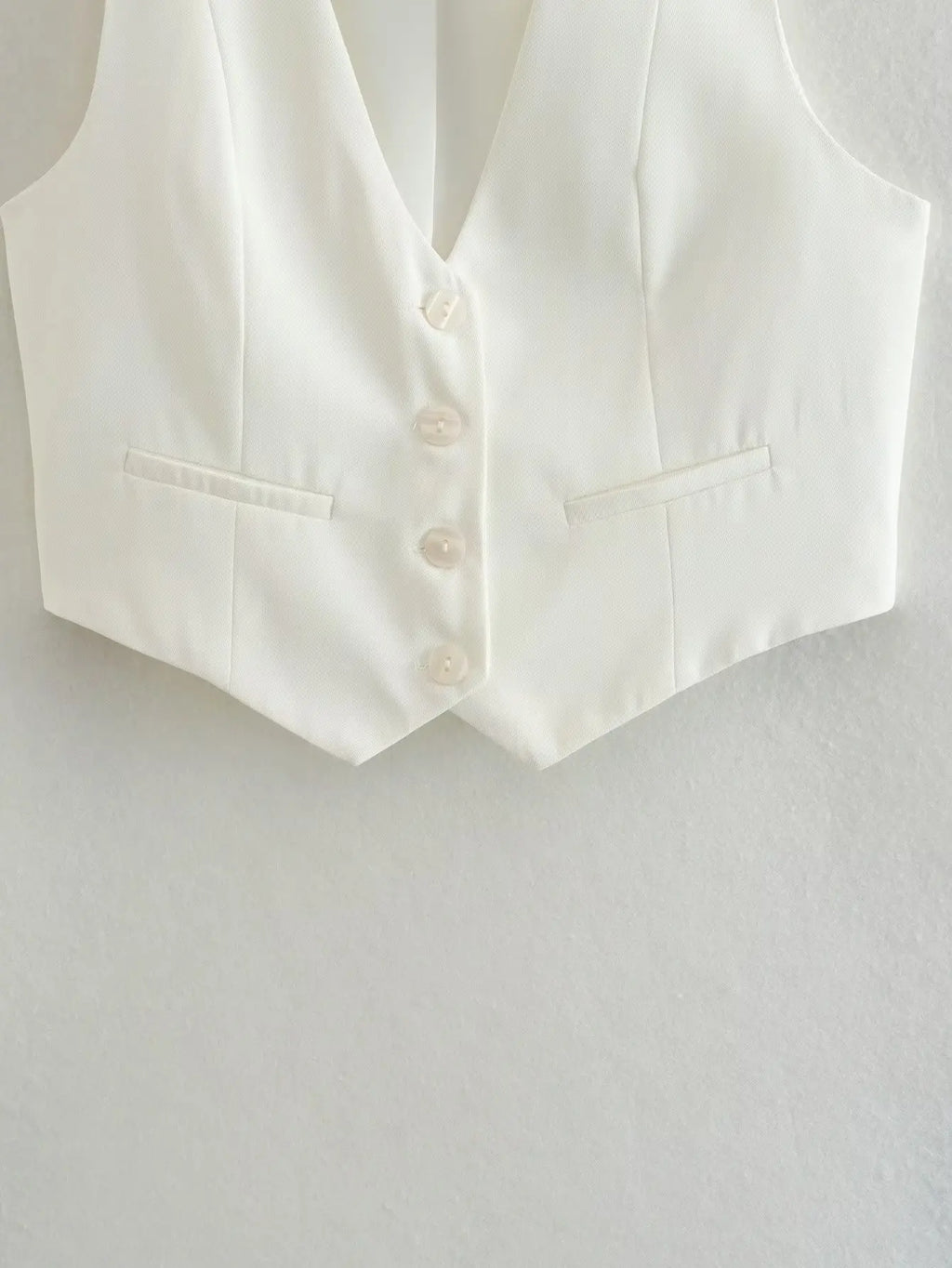 เสื้อกั๊กคลุมสตรีคอวีแขนกุดสไตล์วินเทจสีขาวสุดเก๋