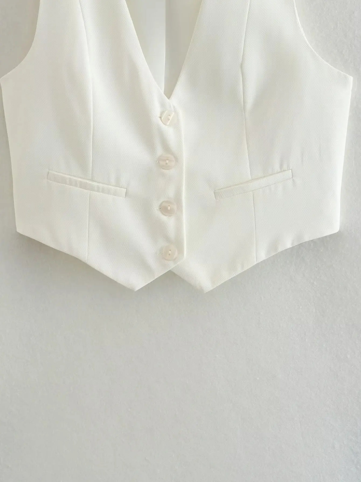 เสื้อกั๊กคลุมสตรีคอวีแขนกุดสไตล์วินเทจสีขาวสุดเก๋